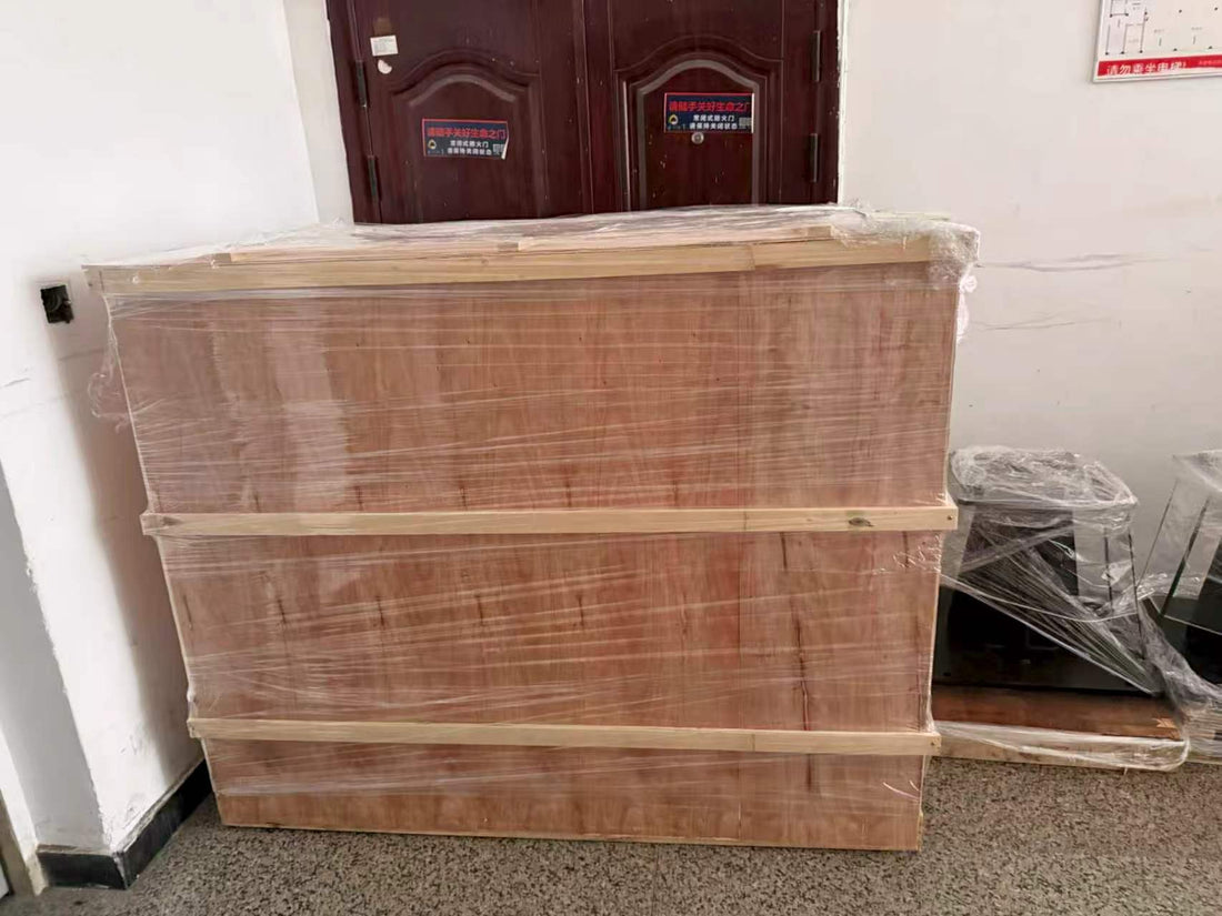 Two customized yellow XARP XP1440-15W welding robots packed for international shipment to Moscow distributor