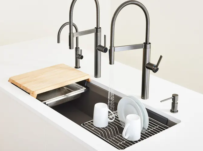 XARP XP1440-15W robotic welding robot performing gas-shielded welding on stainless steel dish rack at furniture manufacturing facility